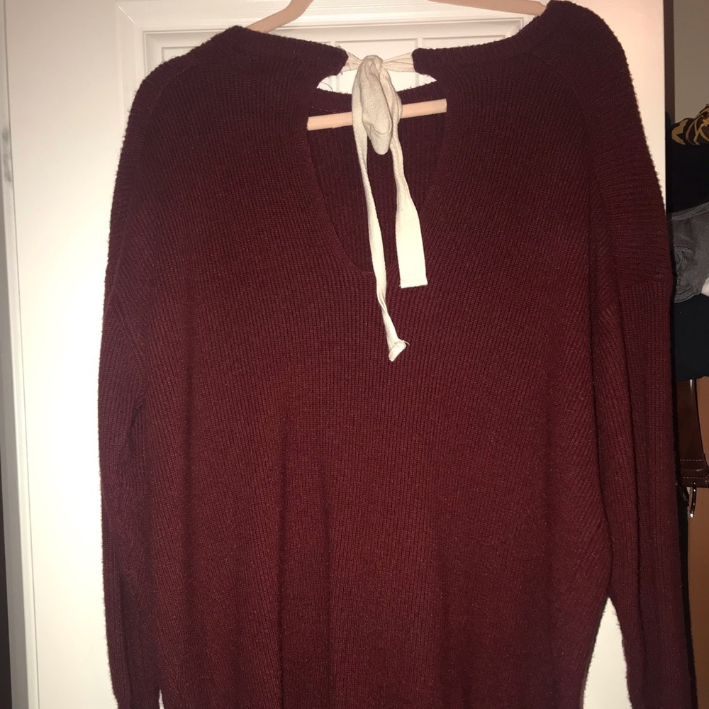 Cute red sweater with bow in back